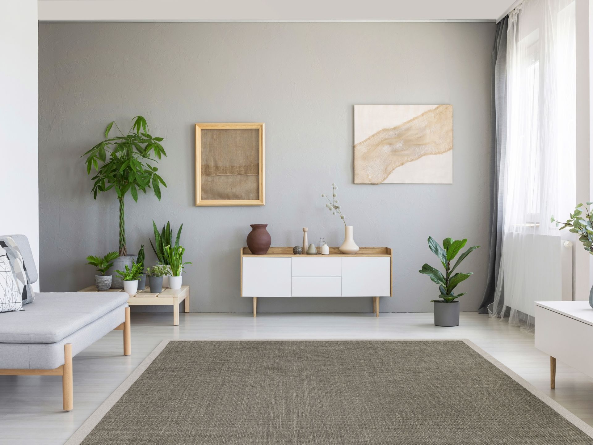 Environment photo of a gray sisal carpet in a modern living room.