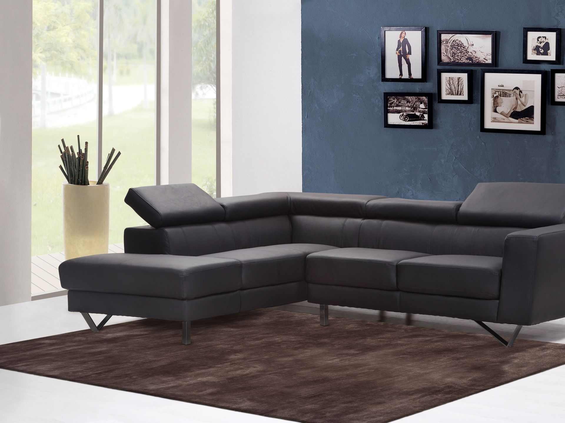 Photo of a red-brown viscose carpet in front of a black leather couch.